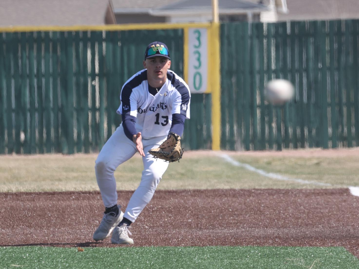 Ashton Ross concentrates on the play as a pitch is thrown in the first game of a doubleheader with Luna. WNCC won both games.