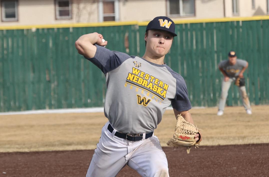 Hunter McCollum tosses a pitch in practice.