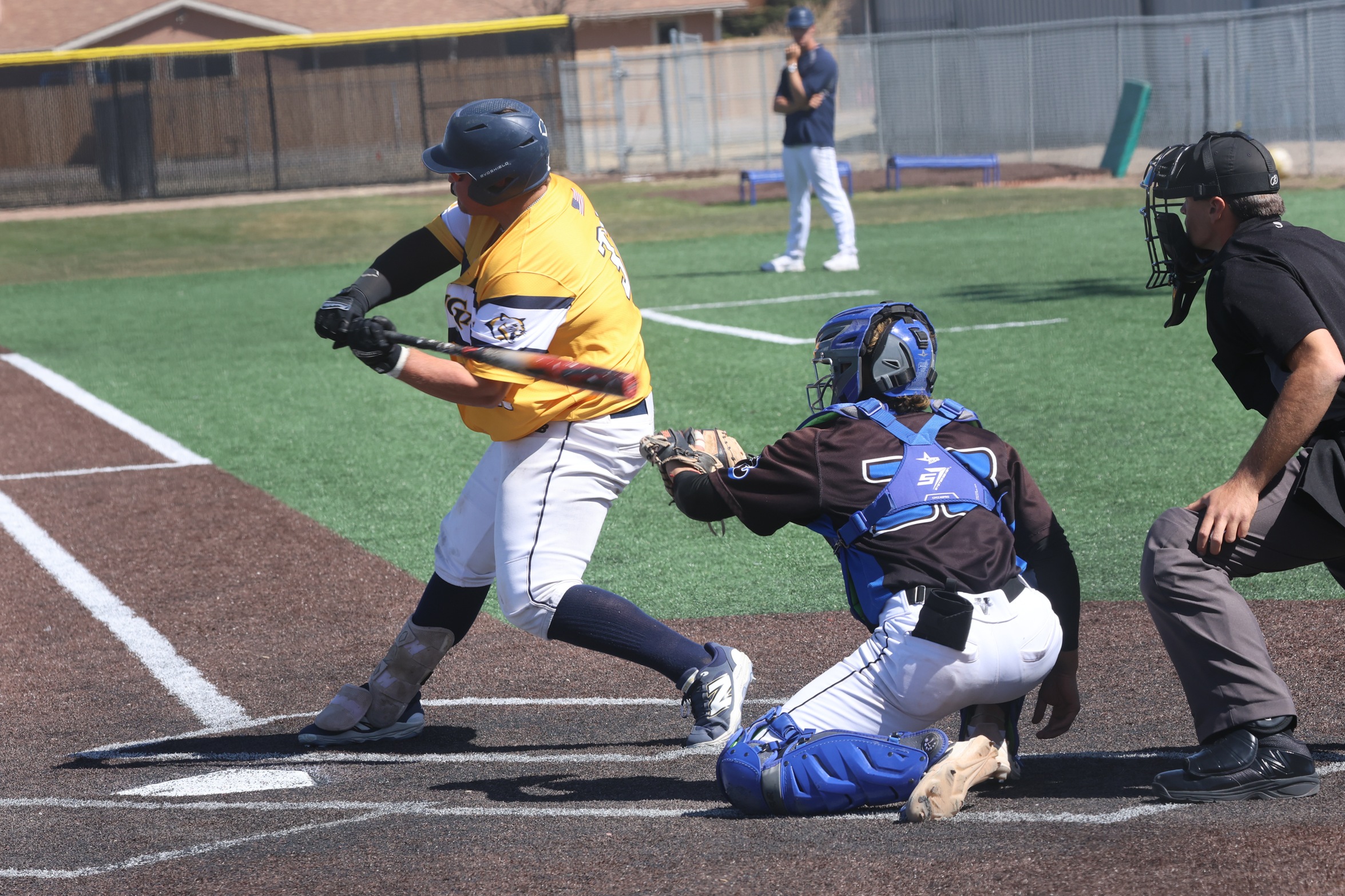 Cooper Burgess takes a swing at a pitch for a double early in the game. WNCC dropped both games on Monday.