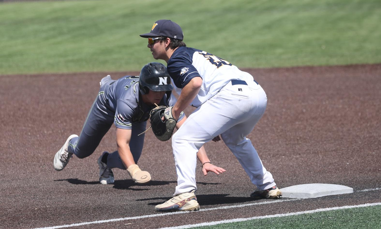 Will Harbison gets ready for a pick-off attempt at first base in the May 1 game with NJC.