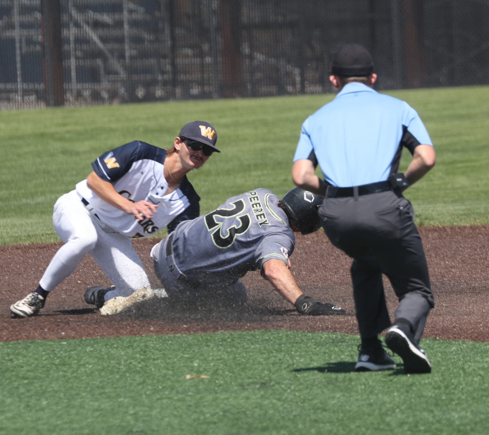 Garrison Burns tags out an NJC runner trying to steal second in their game on May 1 at Cleveland Field.