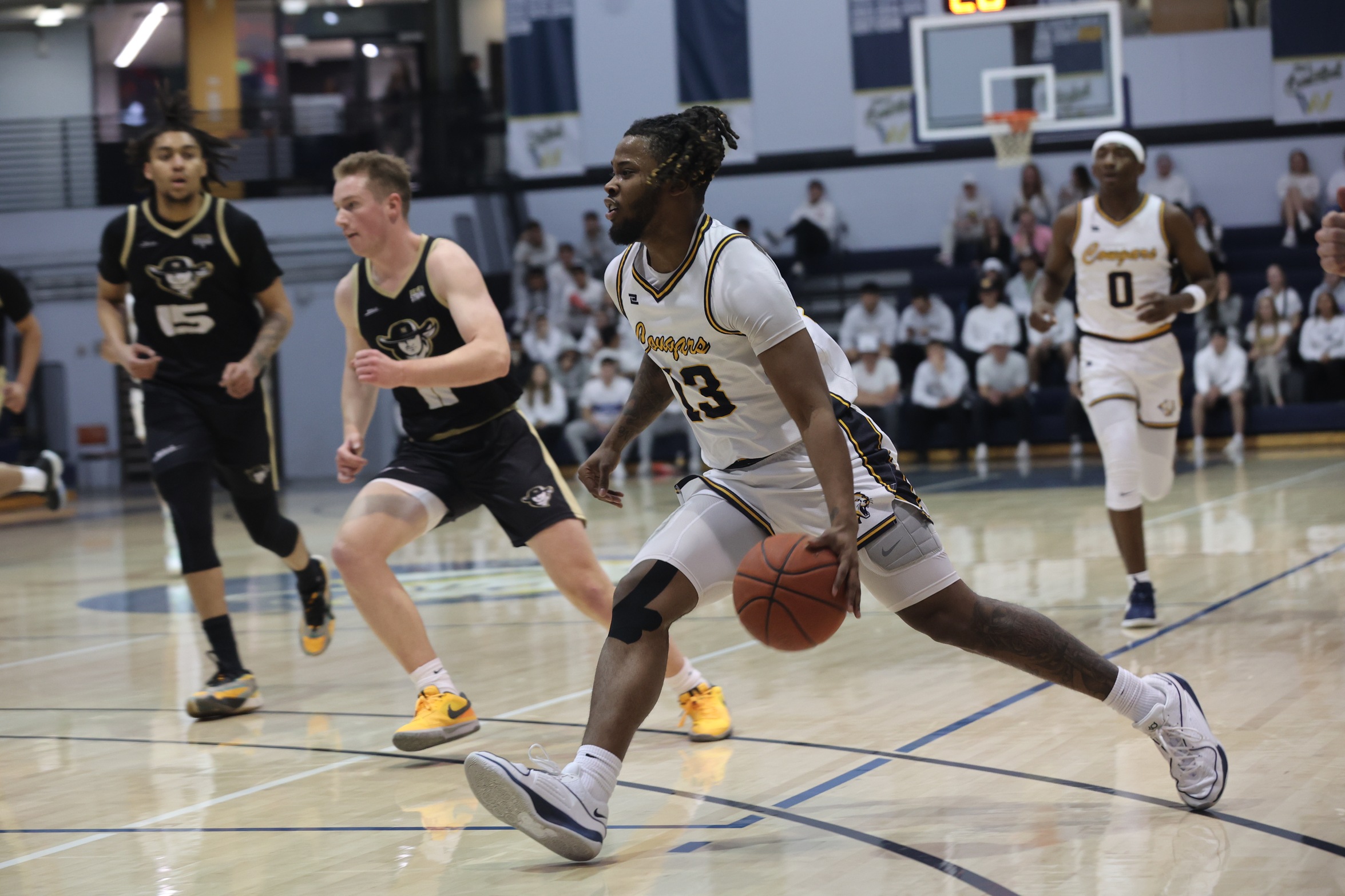 Travis Easterly drives to the bucket against NJC.