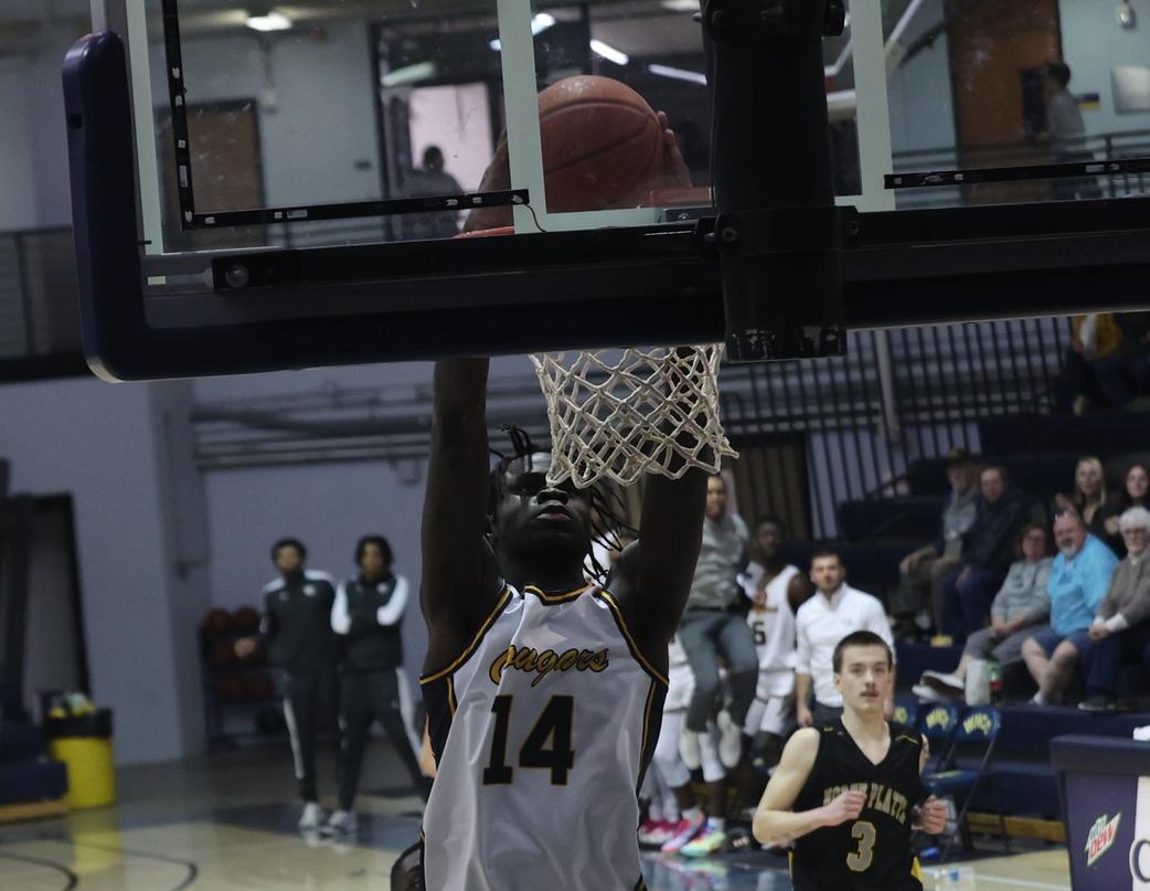 Stephen Ovia dunks in the North Platte game.