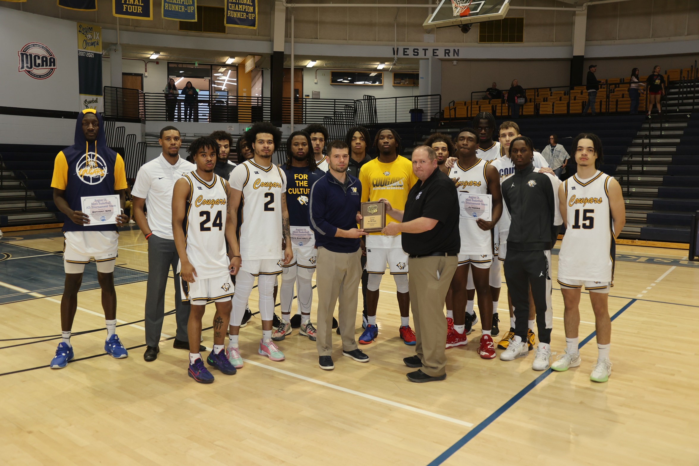 Billy Engel and the team with his Coach of the Year award.