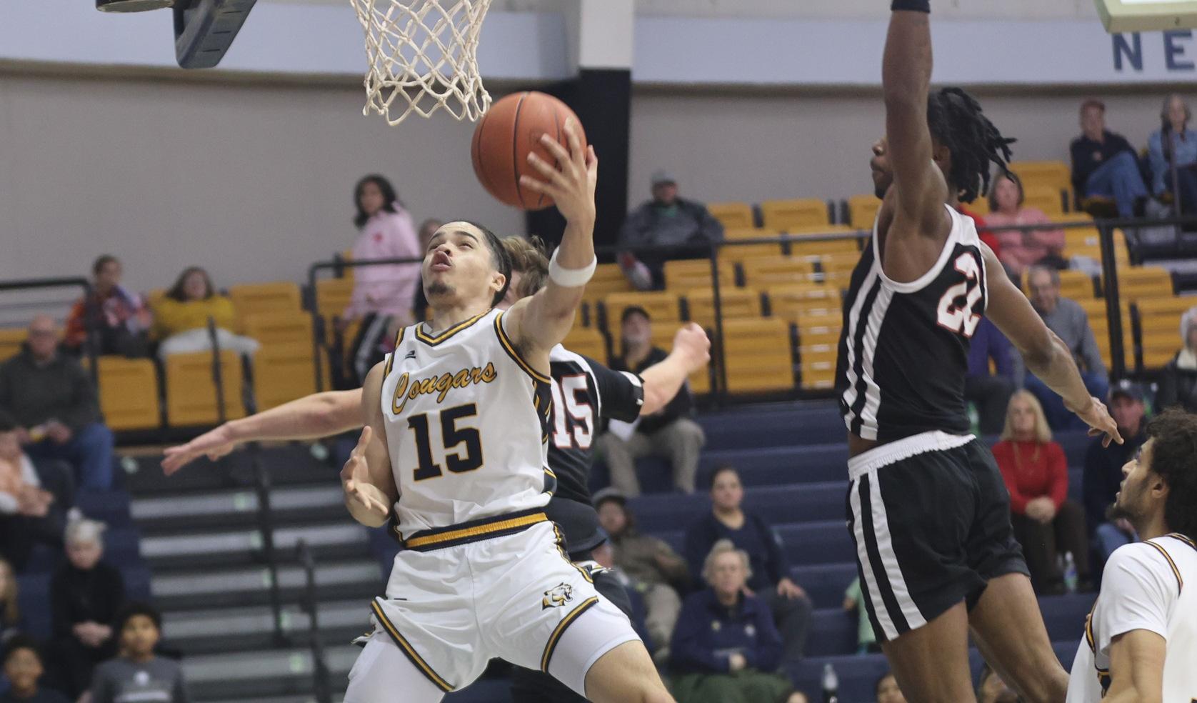 Elijah Burney goes up for a lay-up against Casper in December at Cougar Palace.
