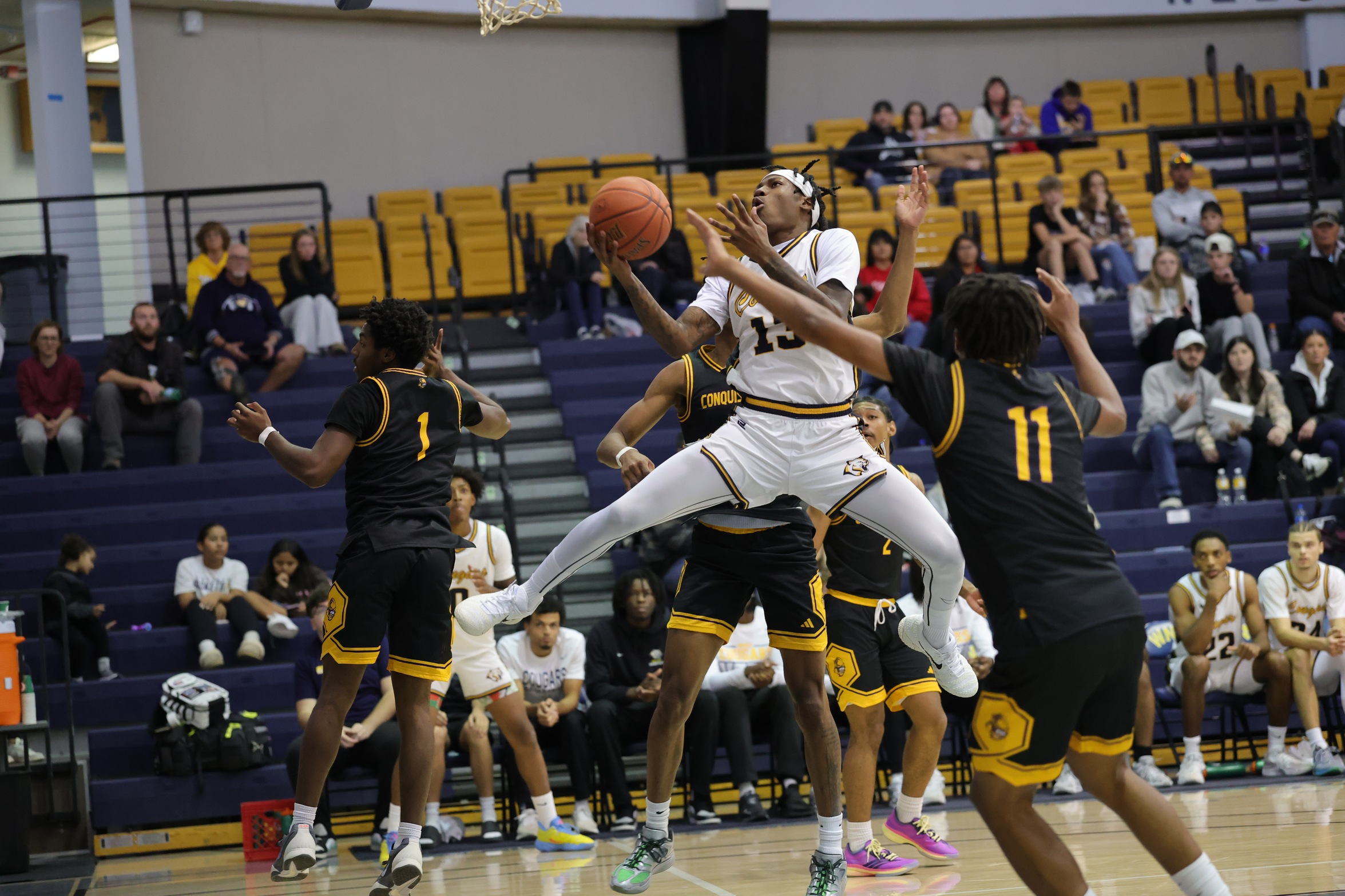 Amare Jackson goes airborne as he heads to the basket in the second half Saturday against Dodge City.