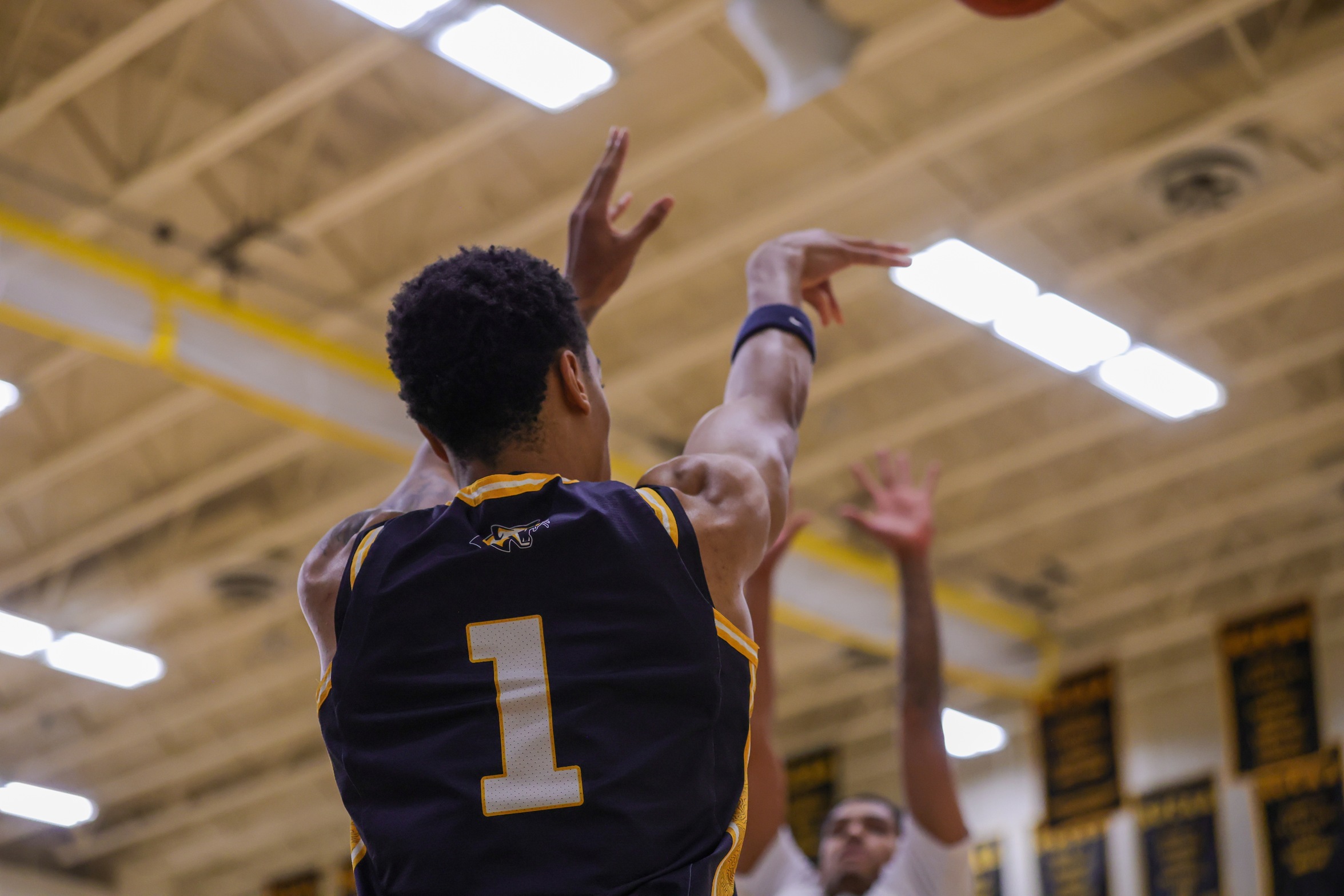 Noah Jones shoots for three in a game against EWC on the road in November.