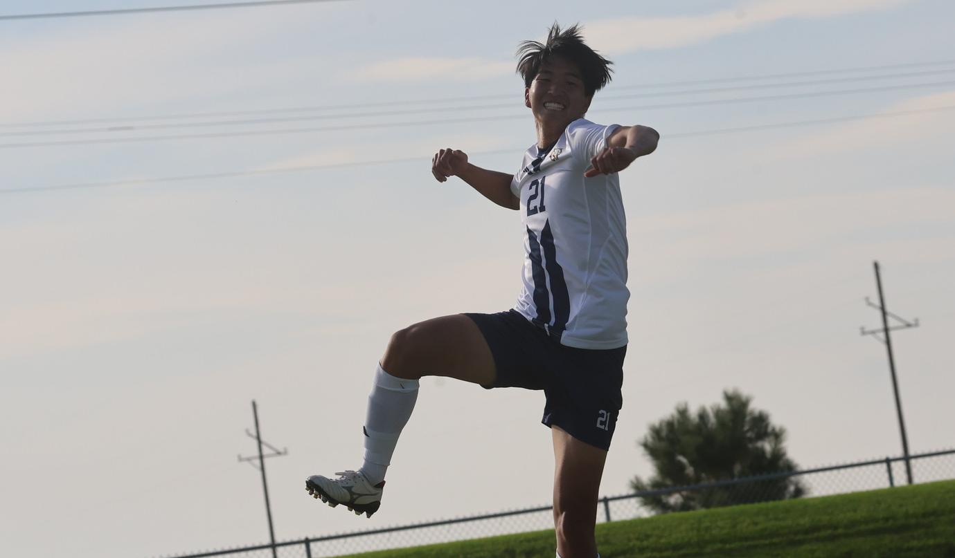 WNCC's Tomoaki Kamiya goes high to celebrate his first-half goal during WNCC's match with Otero on Friday.