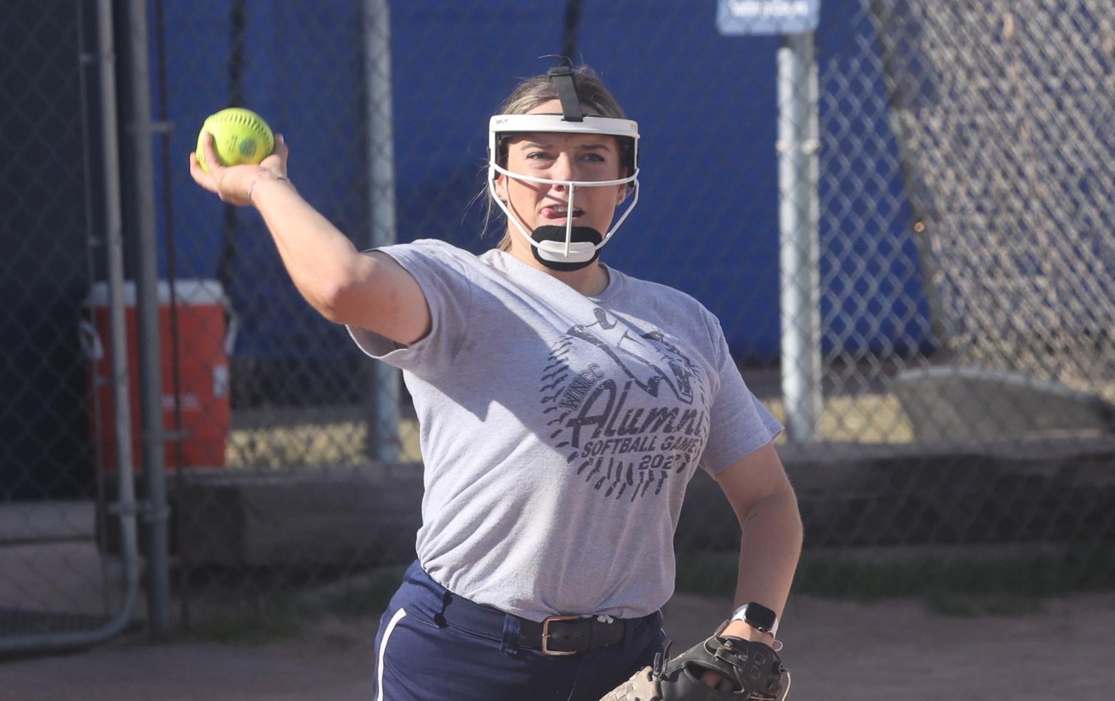 Bree throws to first during a fall game. 