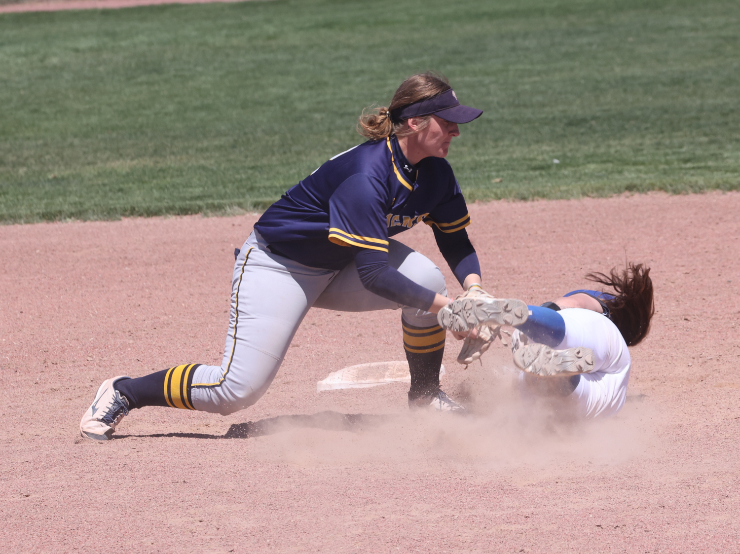 Maddie Johnston tags out a runner at second base.