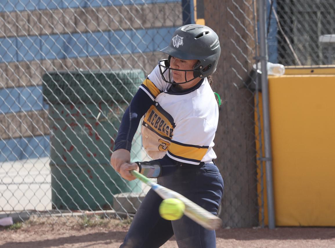 Bailey Legere makes contact with a pitch for a double.