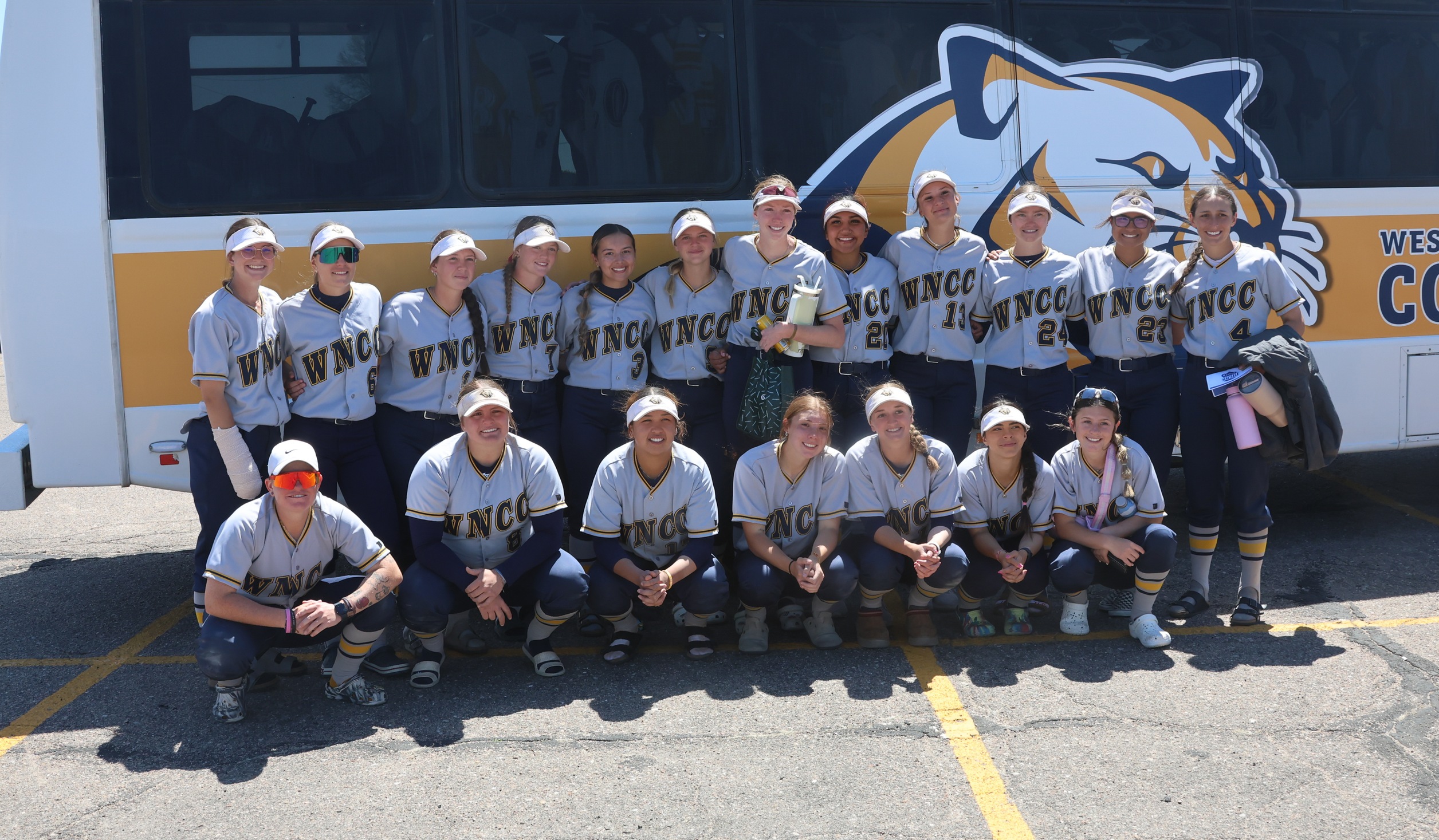 The team by the bus after falling in the championship game. The Cougars had an outstanding season despite the setback.