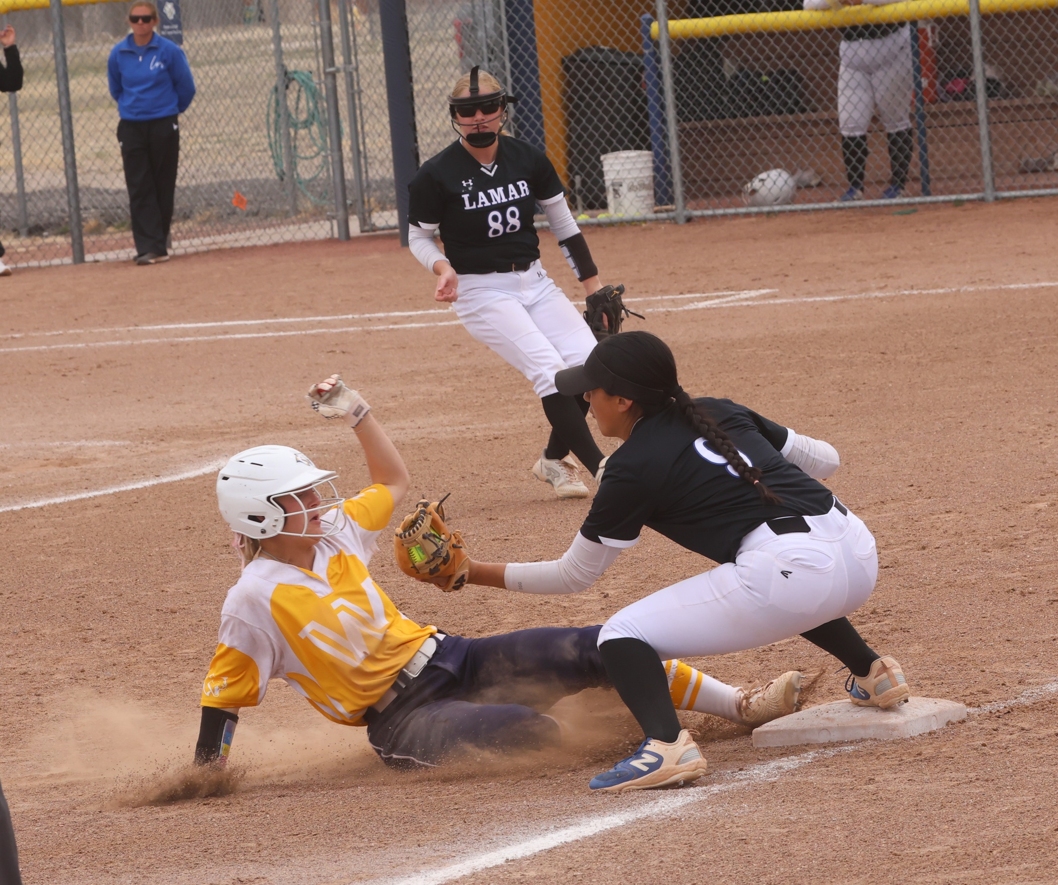 Randi Mitchell slides into third base on her triple in game two of their game with Lamar on Tuesday.