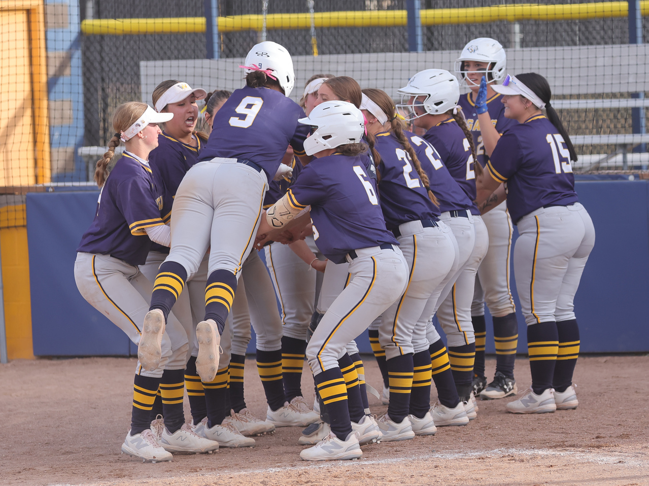 Gracie Holm gets ready to be tossed by her teammates after hitting a sixth-inning home run against NJC>
