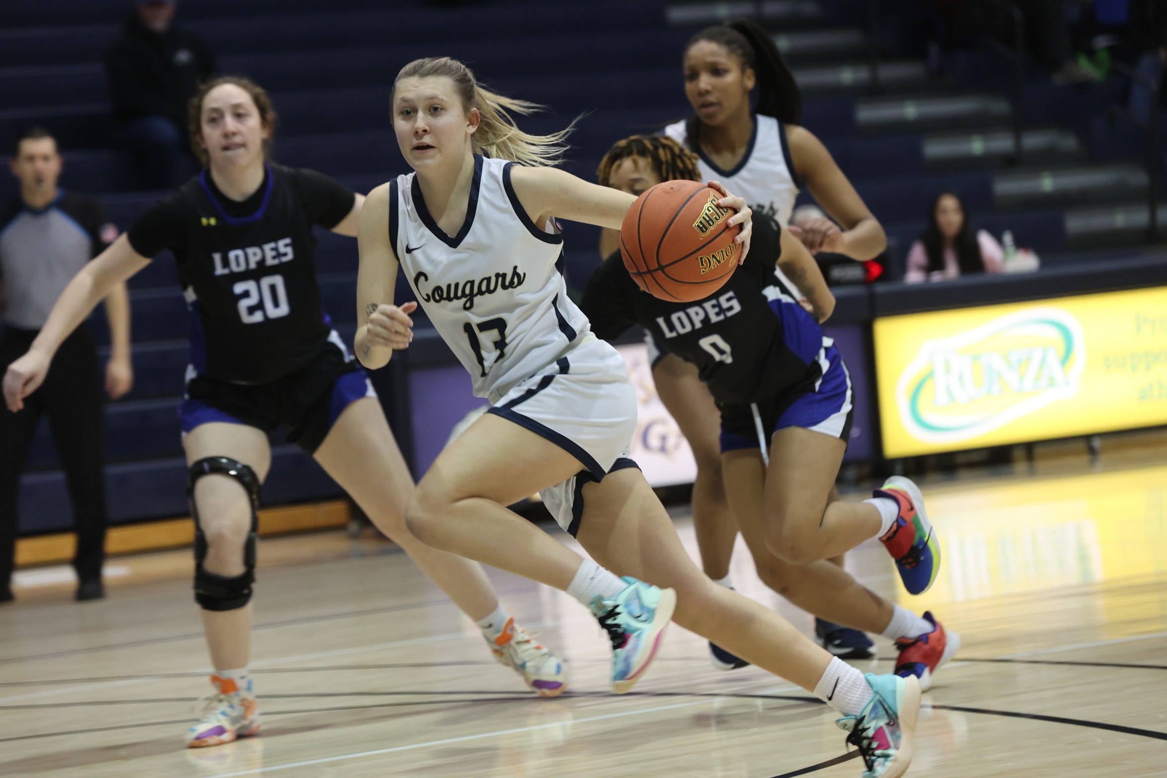 Bre Fowler drives to the hope against Lamar.