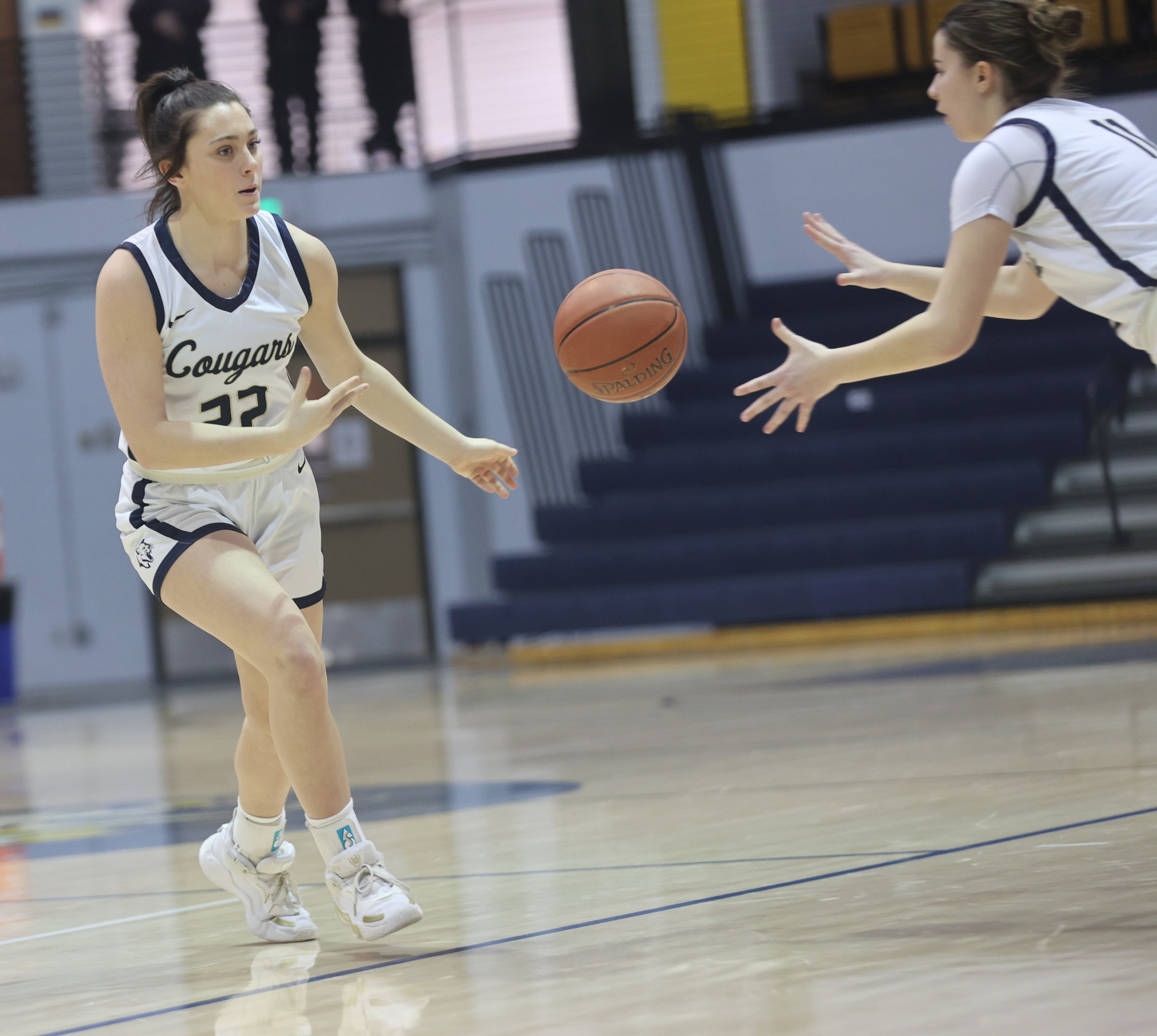 WNCC's Jamie Caron dishes the ball off to Gal-La Font during their game Saturday against Central Wyoming.