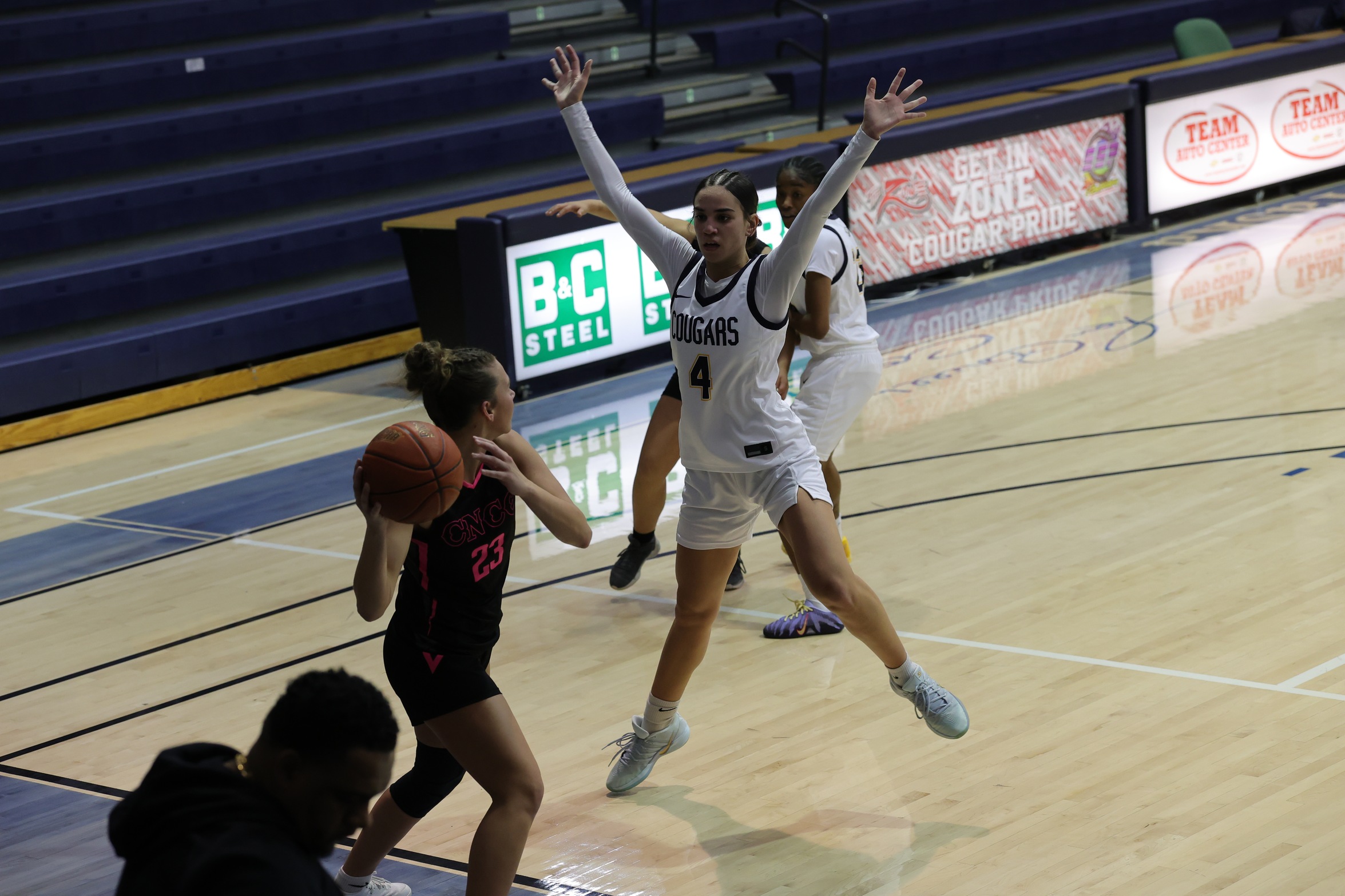 WNCC's Juseana-Rae Delatori jumps in the air as she guards a CNCC inbound play.