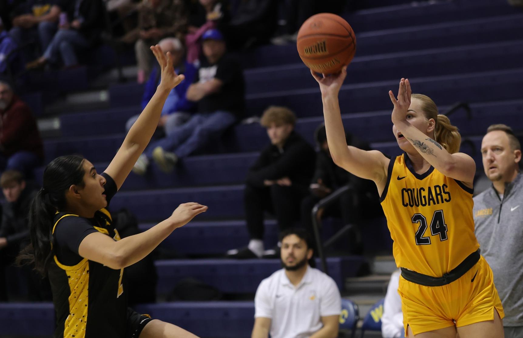 Zozefine Sipolina shoots a 3-pointer in a game with EWC earlier this week.