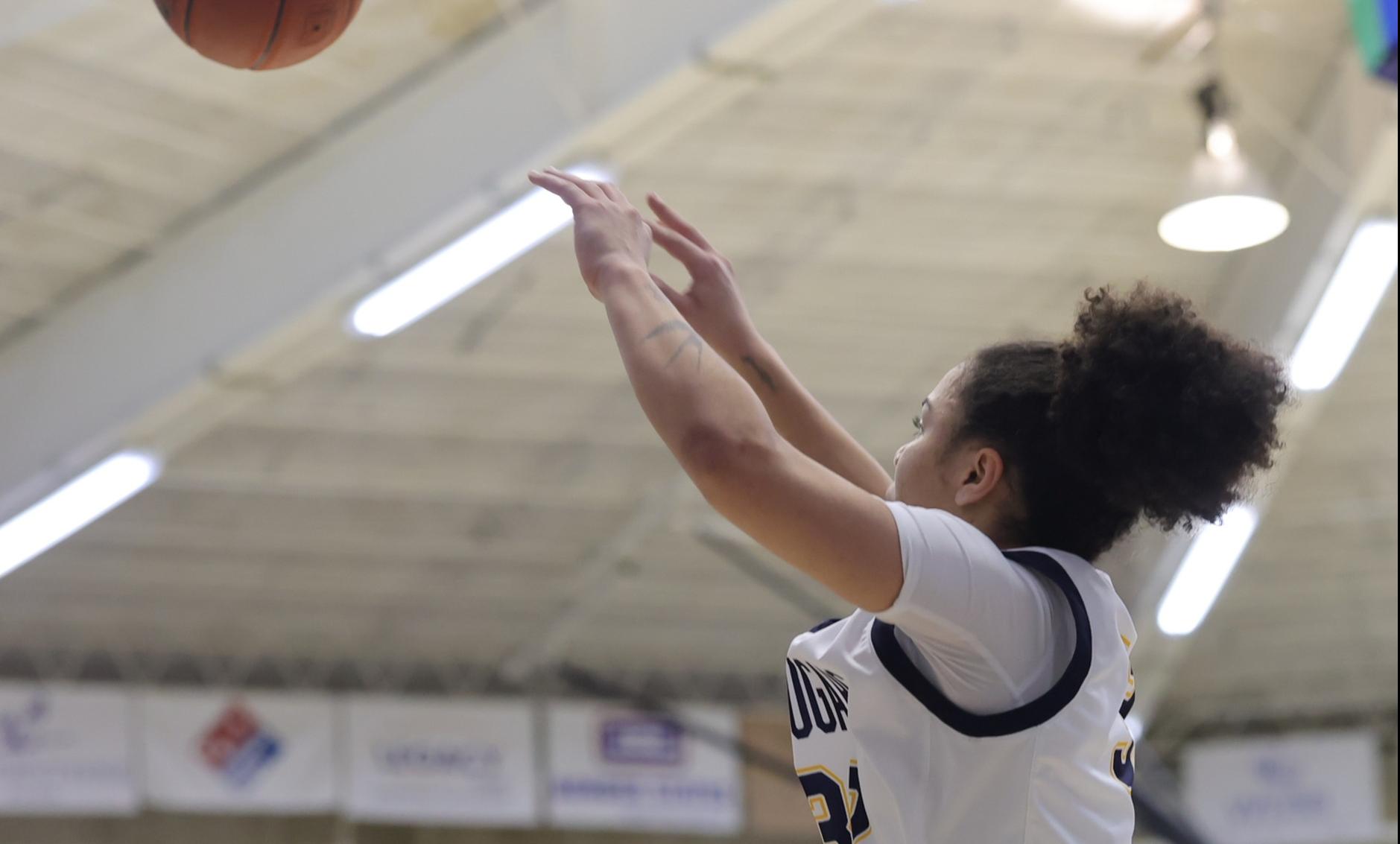 Ella Chesta-Carty takes a shot against Southeast at Cougar Palace in January.