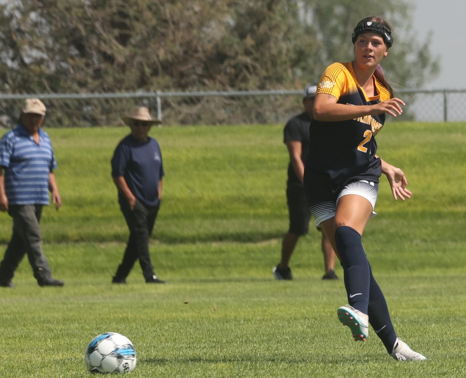 Emilee Hunsley kicks the ball upfield.