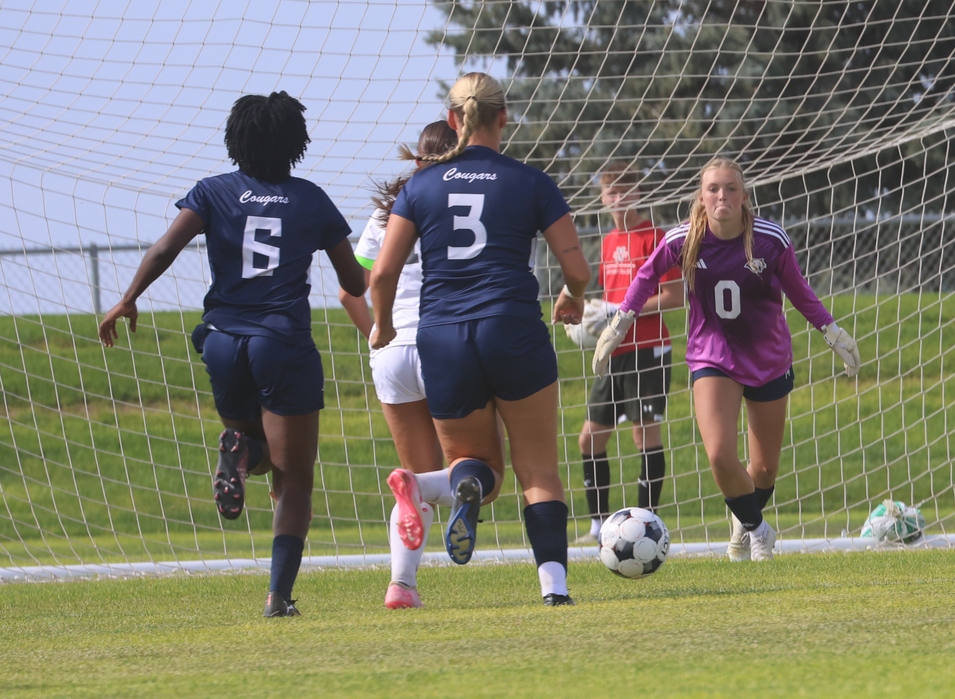 WNCC goalkeeper Marit Schelstraete concentrates as a Northwest player brings the ball toward her for a shot.