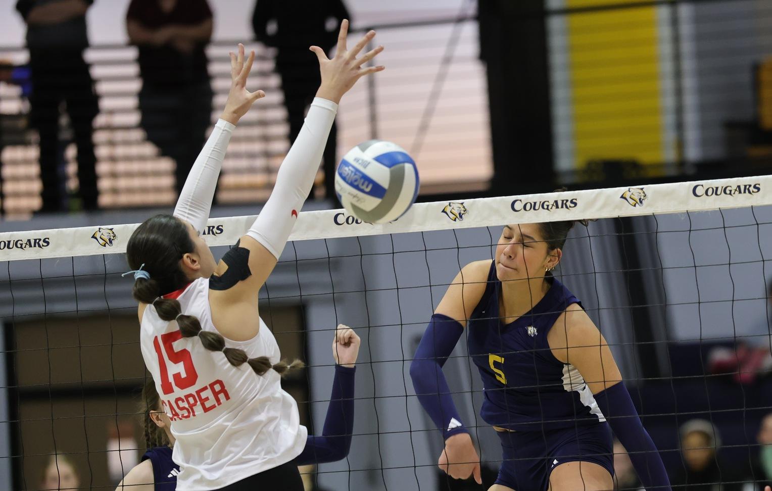 Eli Braithwaite hammers a kill against a Casper defender.