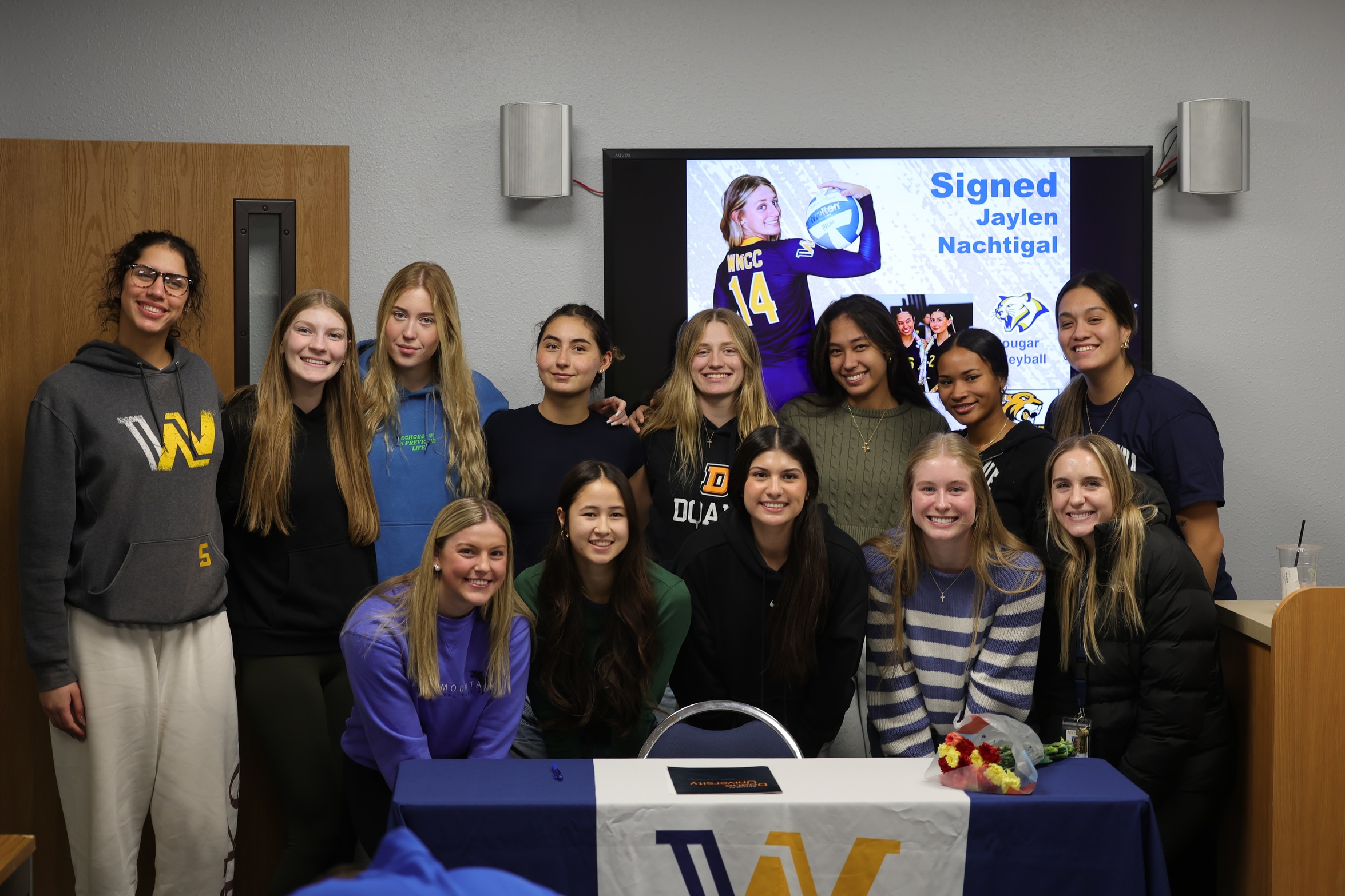 Jaylen Nachtigall and her teammates after Jaylen signed with Doane University Monday afternoon.