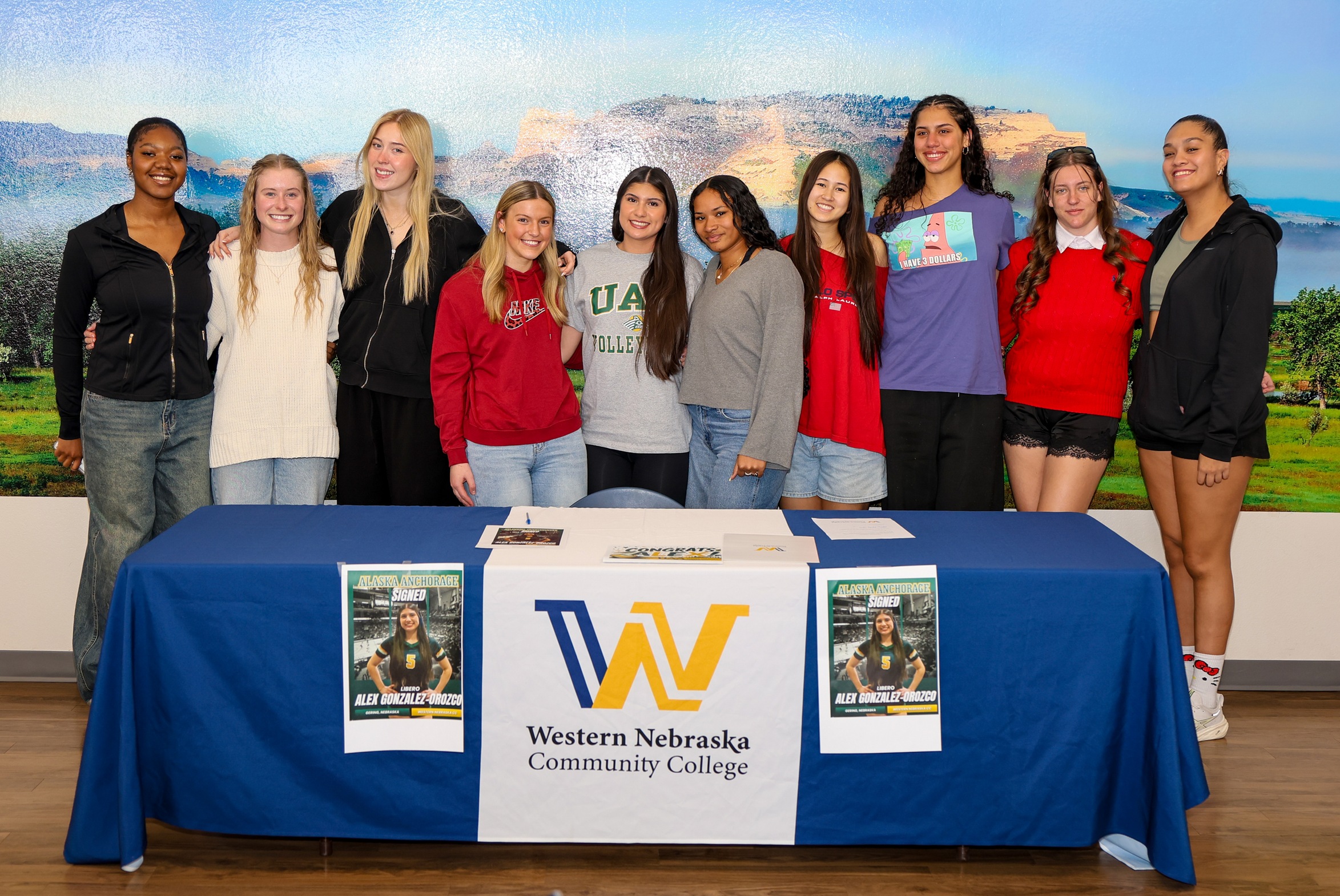 Alex and her team after she signed to continue playing at the University of Alaska Anchorage.