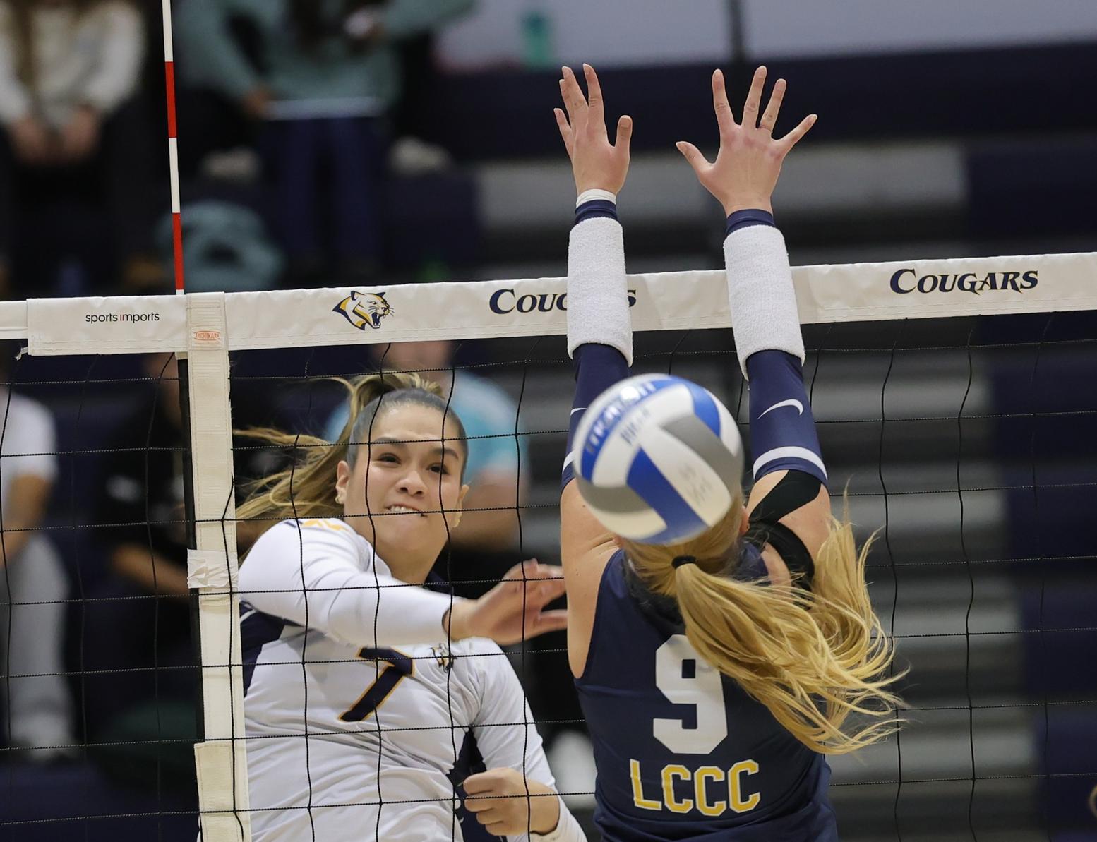 WNCC's Keira Zelada hits the ball past a LCCC blocker in the first set of their Region IX match on Wednesday.