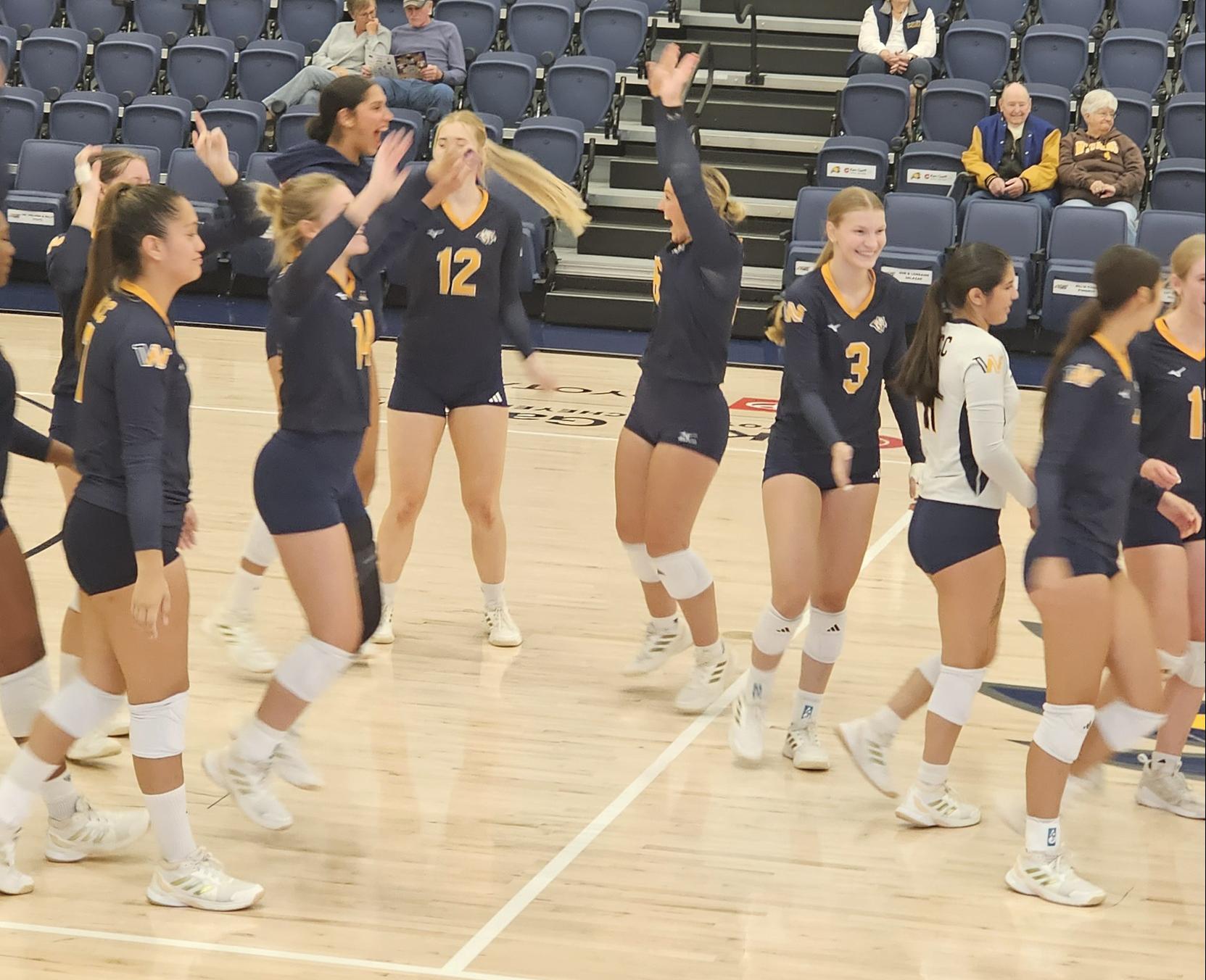 WNCC celebrates after getting a win.
